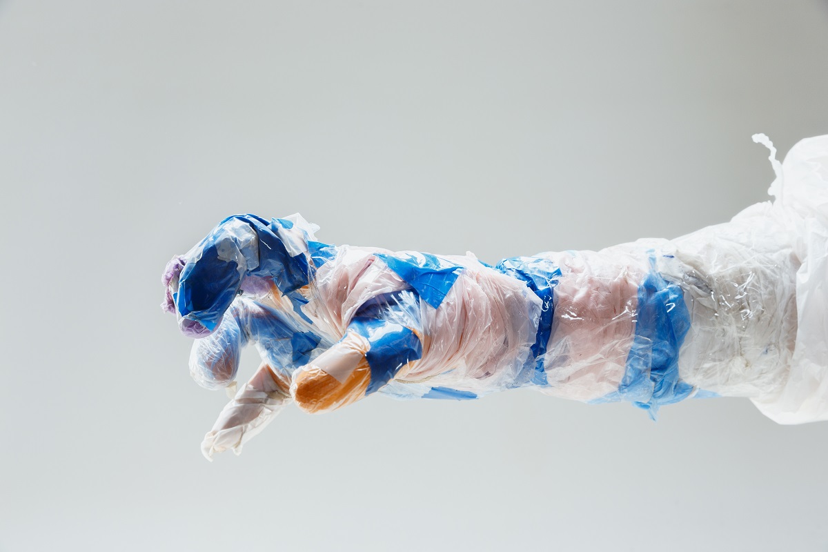 A fully ripped glove worn by a cleanroom operator.